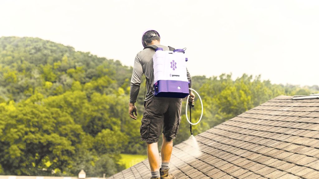 NuRoof Structural Roof Rejuvenation being spray-applied to an asphalt shingle roof